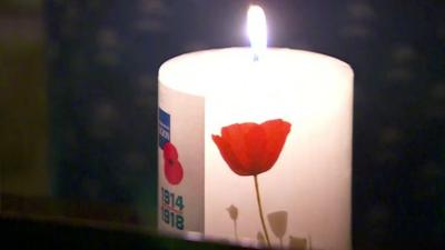 Lit Royal British Legion anniversary candle