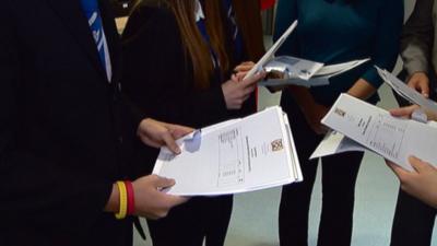 Students open their exam results