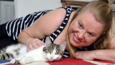 Cat and its owner posing for the camera