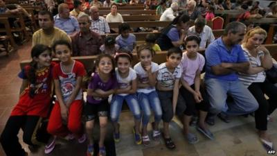 Iraqi Christians who fled Qaraqosh in a church in Erbil