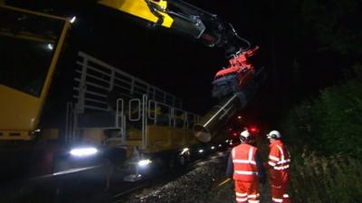 The train works up to five times faster than conventional gangs of track workers