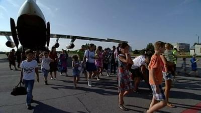 Ukrainian refugees getting off plane