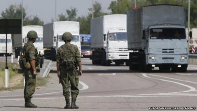 Military personnel and Russian humanitarian convoy.