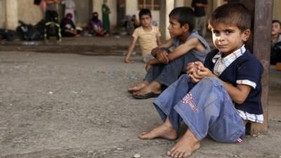 Displaced children from the minority Yazidi sect, fleeing violence in the Iraqi town of Sinjar west of Mosul