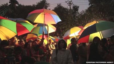 Supporters of Imran Khan listen to his speech during a protest in Islamabad, Pakistan