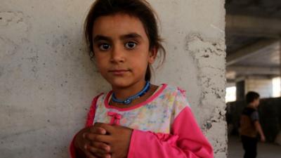 A girl that has fled her home in Iraq