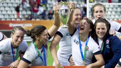 England's players celebrate with the Rugby World Cup trophy