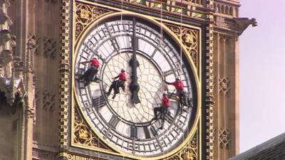 Big Ben's clock face being cleaned