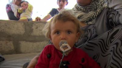 Baby in refugee camp