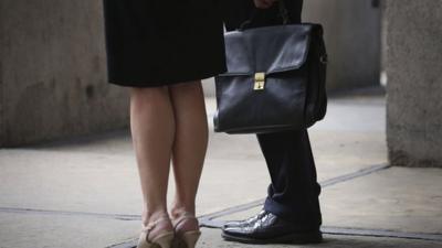 Women and man with briefcase