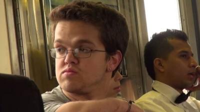 Filmmaker Jonathan Novick sitting on a train in New York