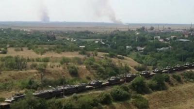 A still from unverified amateur footage show Russian armoured vehicles on railway flat cars, heading in the direction of Ukraine