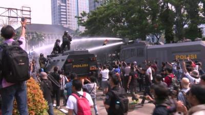 Police fire water cannon