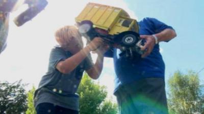 Children working on a model lorry at a model-making summer school in Crawley