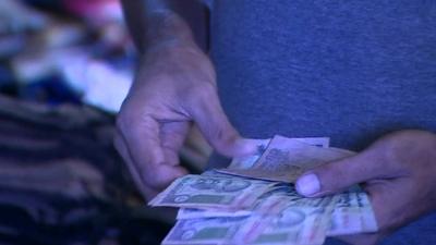 A man counting Rupees