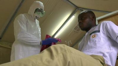Doctor in West Africa practising treatment for Ebola