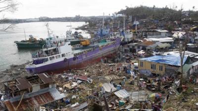 Ship run aground surrounded by debris in the Philippines following Typhoon Haiyan