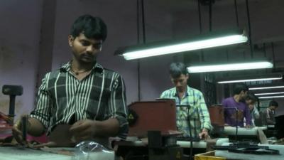 Workers in a shoe factory