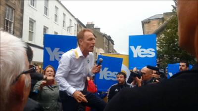 Jim Murphy is hit by an egg