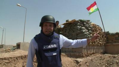 BBC reporter Reda al Mawy reporting from outside the Iraqi village of Amerli