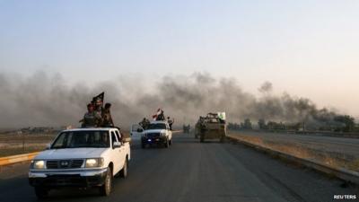 Iraqi Shiite militia fighters in their vehicles after breaking the siege of Amerli by Islamic State militants, 1 September 2014