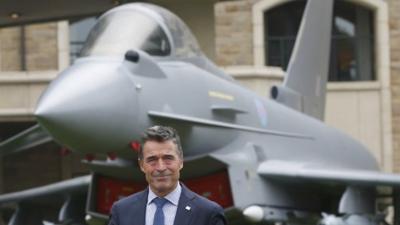 NATO Secretary-General Anders Fogh Rasmussen prepares to speak to the media at the Celtic Manor resort, near Newport, in Wales September 4, 2014