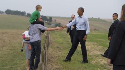 Janice and James Raffle and their children meet President Obama