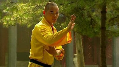 Buddhist monk at Shaolin Temple in China doing Kung Fu