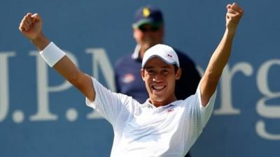 Kei Nishikori of Japan celebrates after defeating Novak Djokovic of Serbia in their men's singles semi final, New York, 6 September 2014