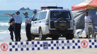 Australian police inspect beach at Byron Bay