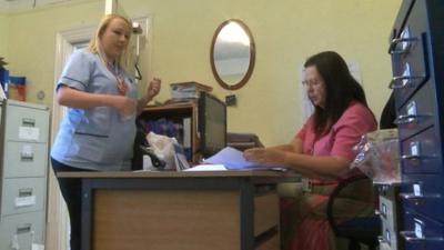 Carer Janine Pugh (left) receives her next list of visits