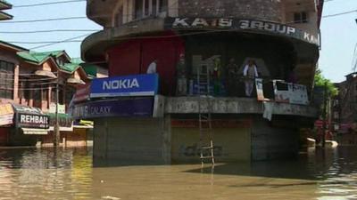 Shop in flooded street