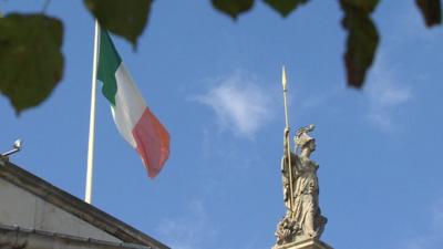 Flag and statue above Irish post office