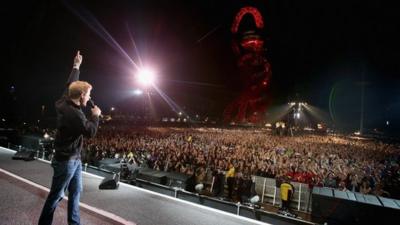 Prince Harry gives a speech on stage at the Invictus Games Closing Ceremony during the Invictus Games at Queen Elizabeth park on September 14, 2014 in London, England