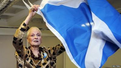 Vivienne Westwood poses with the Saltire flag of Scotland