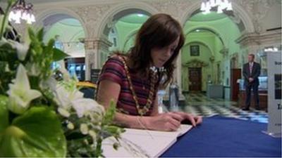 Lord Mayor of Belfast Nicola Mallon signs the book of condolence