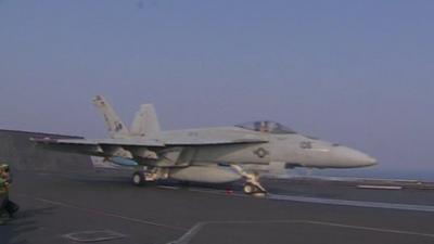 An American plane on an aircraft carrier