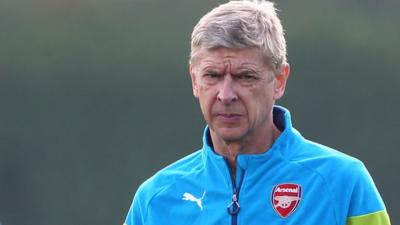 Arsenal manager Arsene Wenger looks on during training