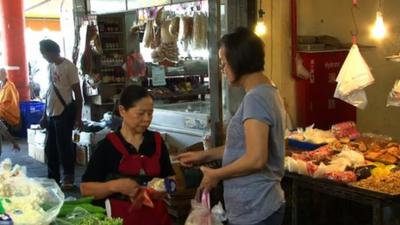 Chen Shu-chu at her vegetable stand in Taitung market in Taiwan