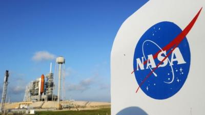 The NASA logo near the space shuttle Endeavour at the Kennedy Space Centre in Florida.