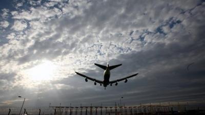 A plane landing at Heathrow Airport