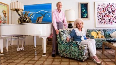 Photograph of a couple in their living room in Palm Springs