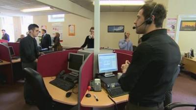 Call centre staff standing up to do their jobs