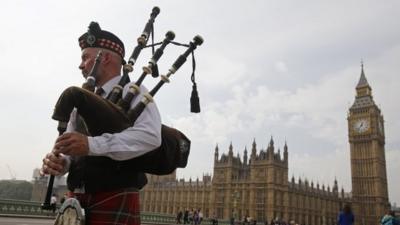 A bagpiper outside Westminster