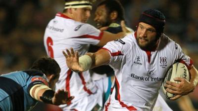 Dan Tuohy of Ulster gets past Matthew Rees of Cardiff Blues to score