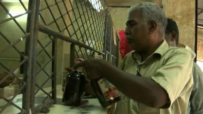 Man buying alcohol in Kerala