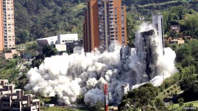 The flats are demolished during a controlled demolition in Medellin