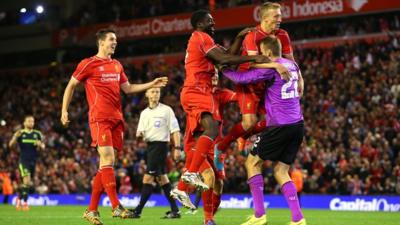 Liverpool players celebrate after winning on penalties against Middlesbrough in the Capital One Cup