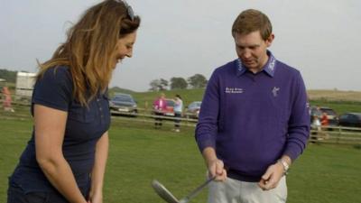 BBC Scotland's Catriona Shearer is given a golf lesson by Stephen Gallacher