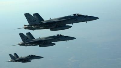 a formation of US Navy F-18E Super Hornets in flight after receiving fuel from a KC-135 Stratotanker over northern Iraq, on September 23 2014